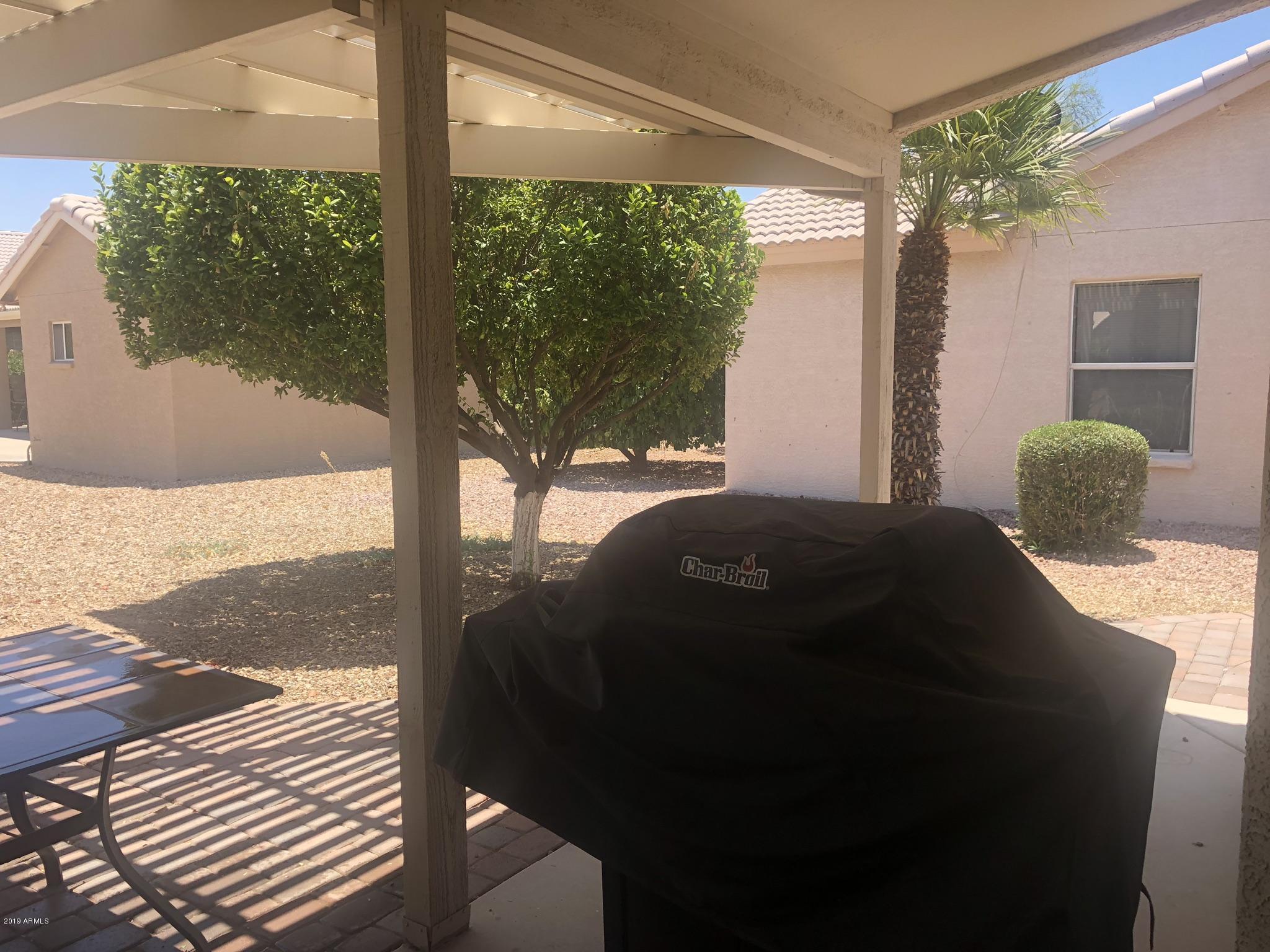 3923 North 151st Avenue Goodyear, AZ 85395 - Photo 21 of 22 a bedroom with a bed and a large window