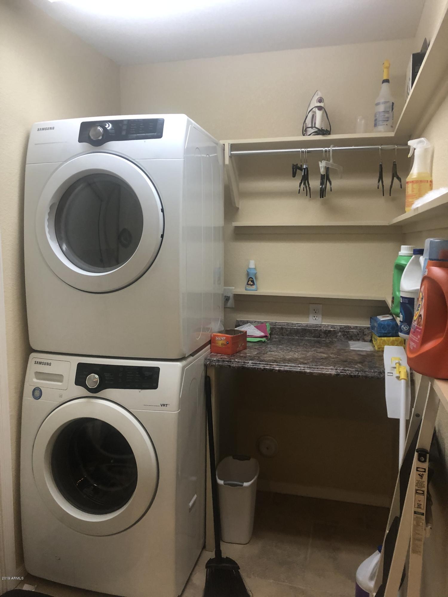 3923 North 151st Avenue Goodyear, AZ 85395 - Photo 22 of 22 a utility room with dryer and washer