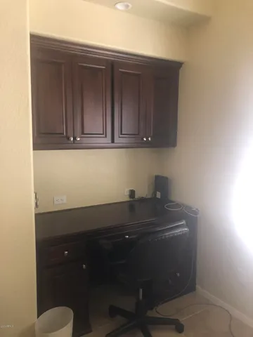 a room with a sink and cabinets