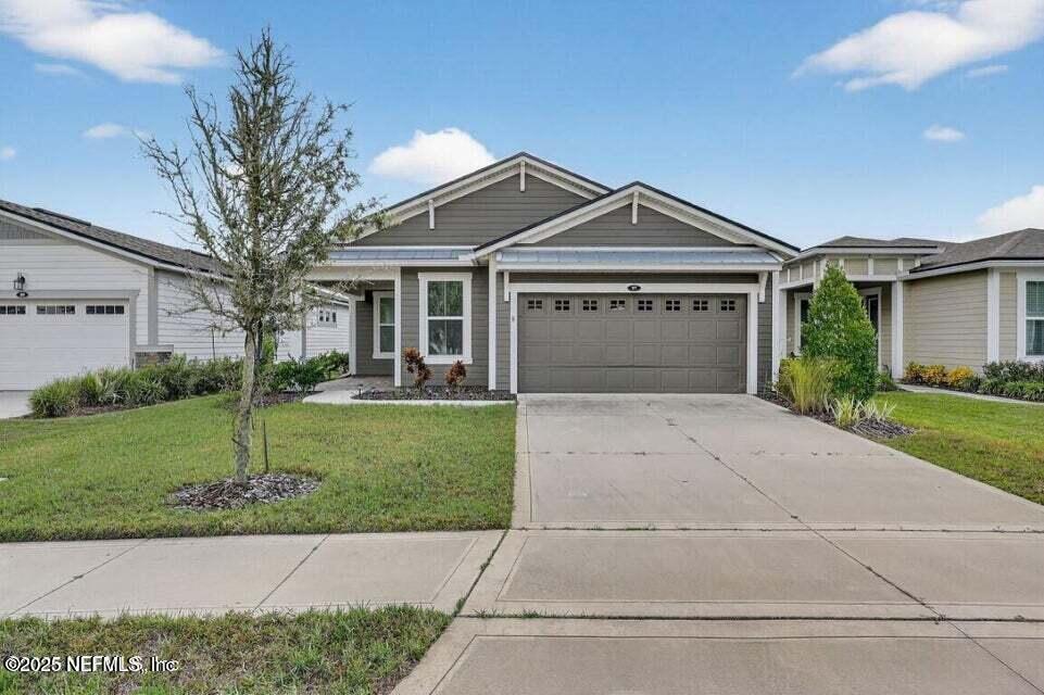 97 Kellet Way St. Johns, FL 32259 - Photo 2 of 23 a front view of a house with a garden and yard