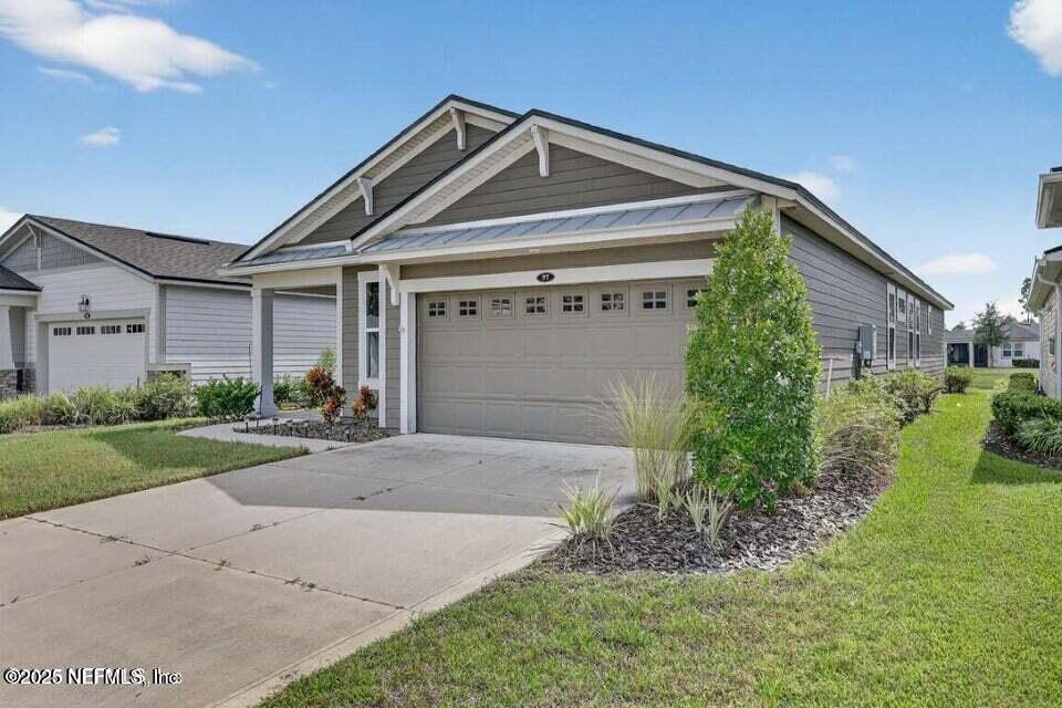 97 Kellet Way St. Johns, FL 32259 - Photo 3 of 23 a front view of a house with a yard and garage