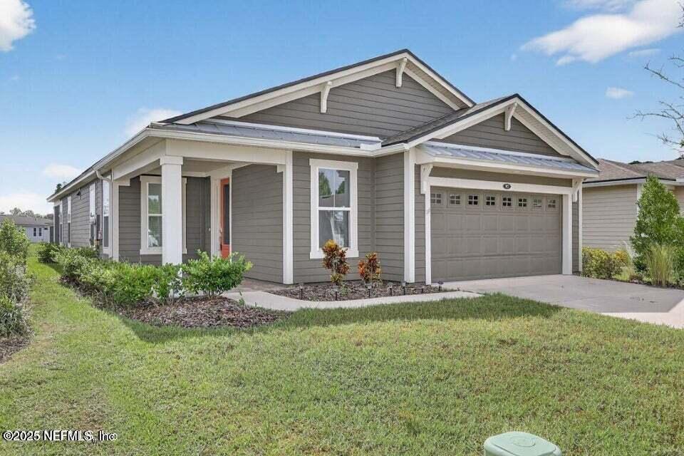 97 Kellet Way St. Johns, FL 32259 - Photo 4 of 23 a front view of a house with a yard and garage