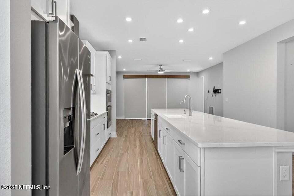 97 Kellet Way St. Johns, FL 32259 - Photo 7 of 23 a large white kitchen with a white stove top oven and refrigerator