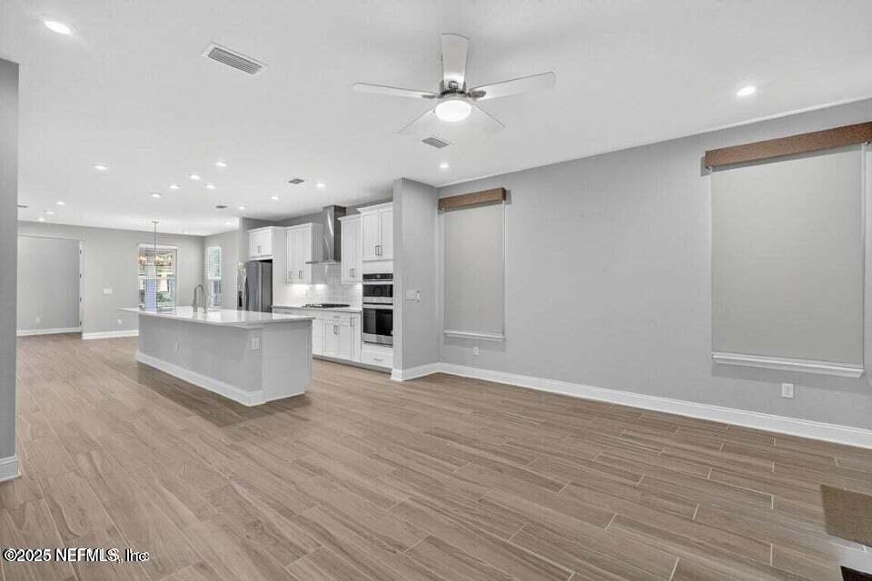 97 Kellet Way St. Johns, FL 32259 - Photo 10 of 23 a view of kitchen with cabinets and wooden floor