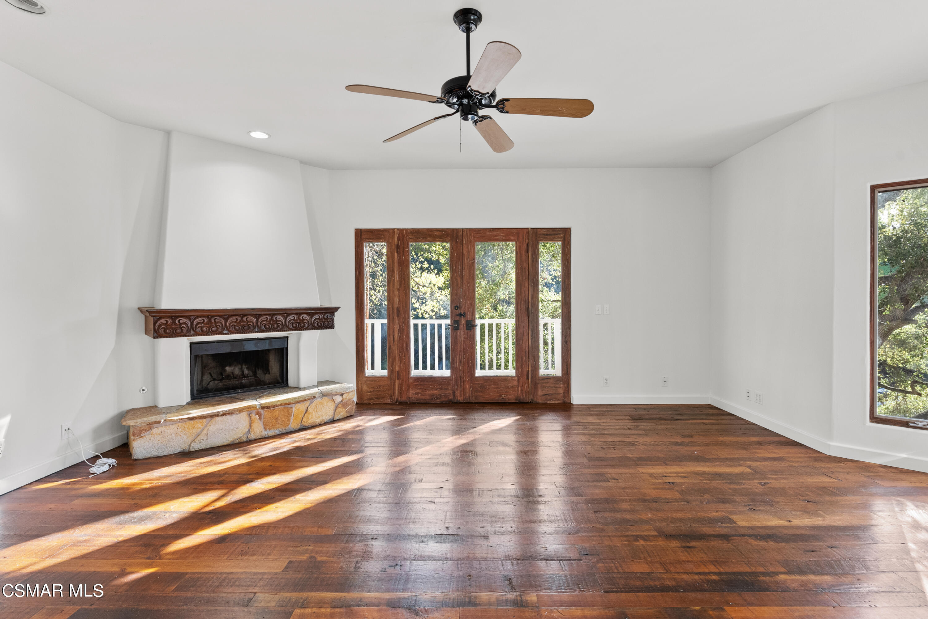 2045 Lookout Drive Agoura Hills, CA 91301 - Photo 11 of 34 a view of an empty room with a fireplace and a window