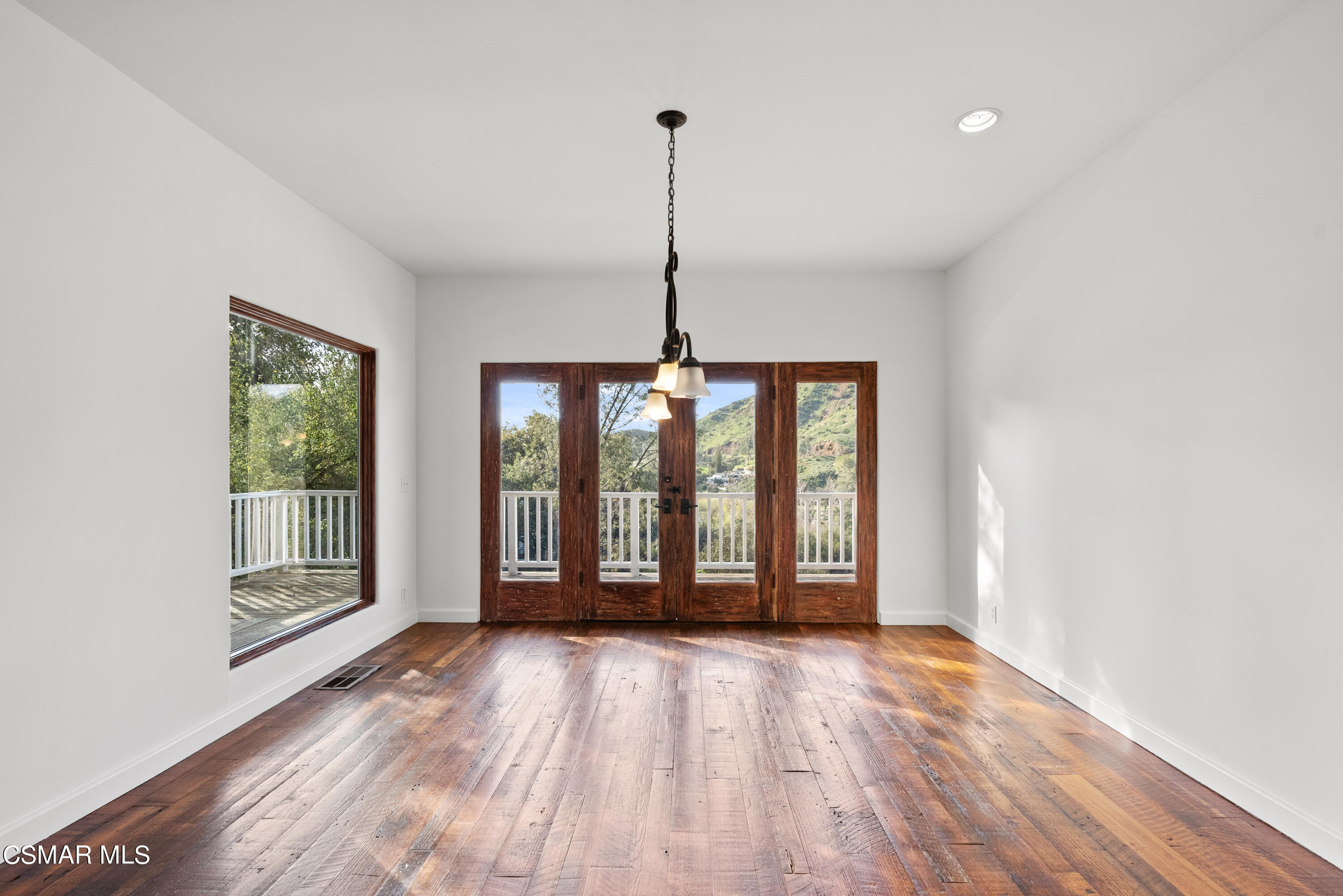 2045 Lookout Drive Agoura Hills, CA 91301 - Photo 12 of 34 a view of an empty room with glass door and windows
