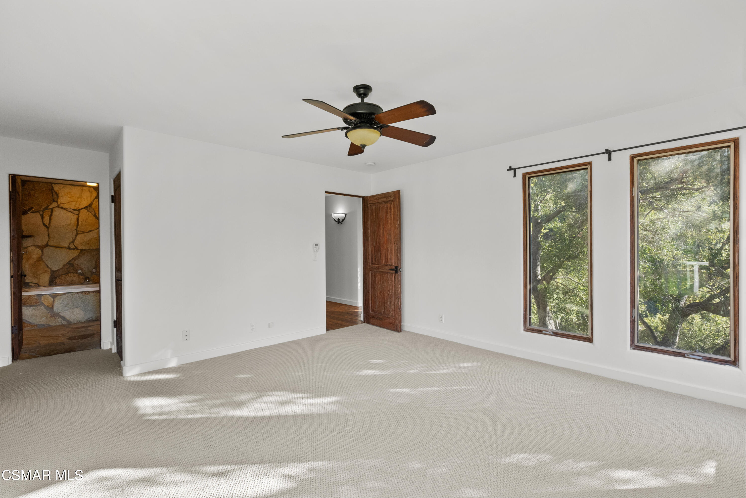 2045 Lookout Drive Agoura Hills, CA 91301 - Photo 18 of 34 a view of a livingroom with a ceiling fan and window