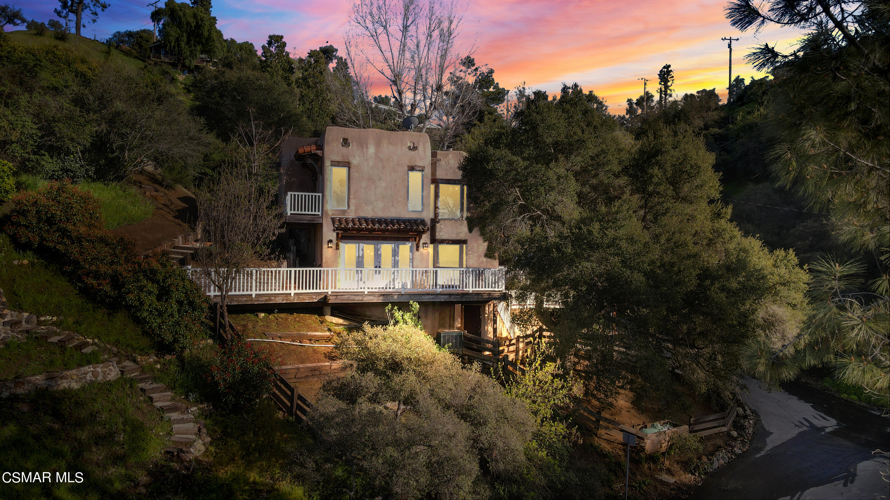 2045 Lookout Drive Agoura Hills, CA 91301 - Photo 2 of 34 a house with trees in the background