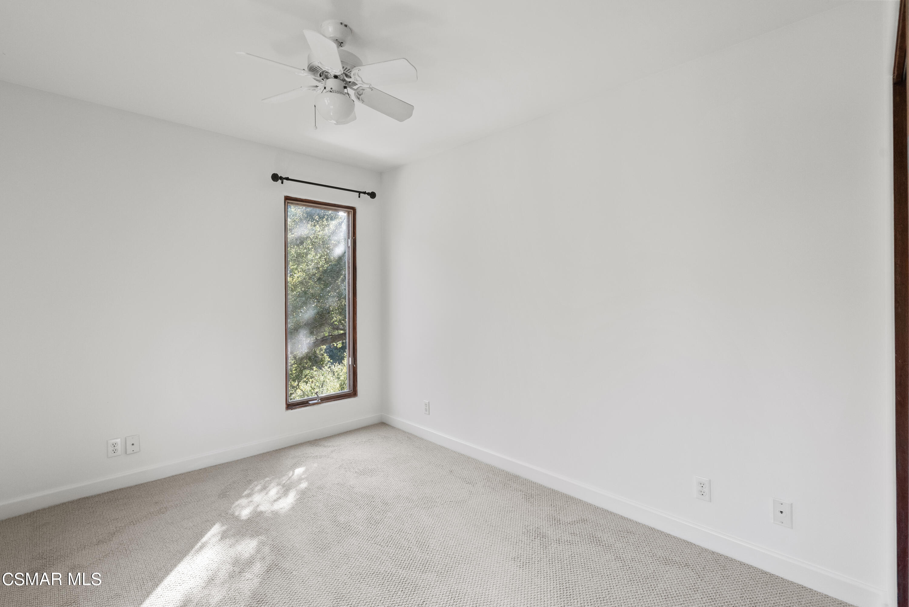 2045 Lookout Drive Agoura Hills, CA 91301 - Photo 23 of 34 an empty room with windows and fan