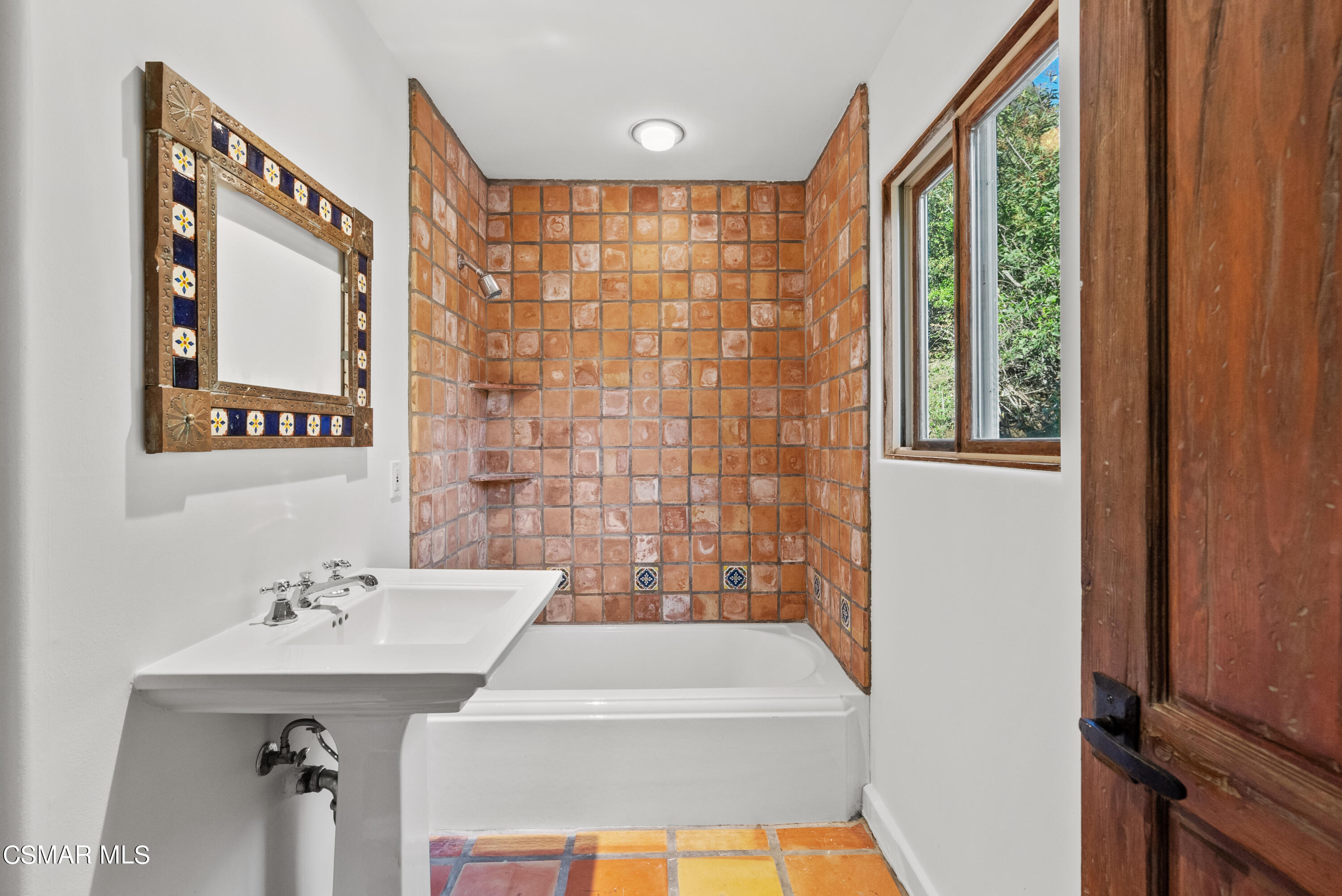 2045 Lookout Drive Agoura Hills, CA 91301 - Photo 25 of 34 a bathroom with a sink a mirror and a shower