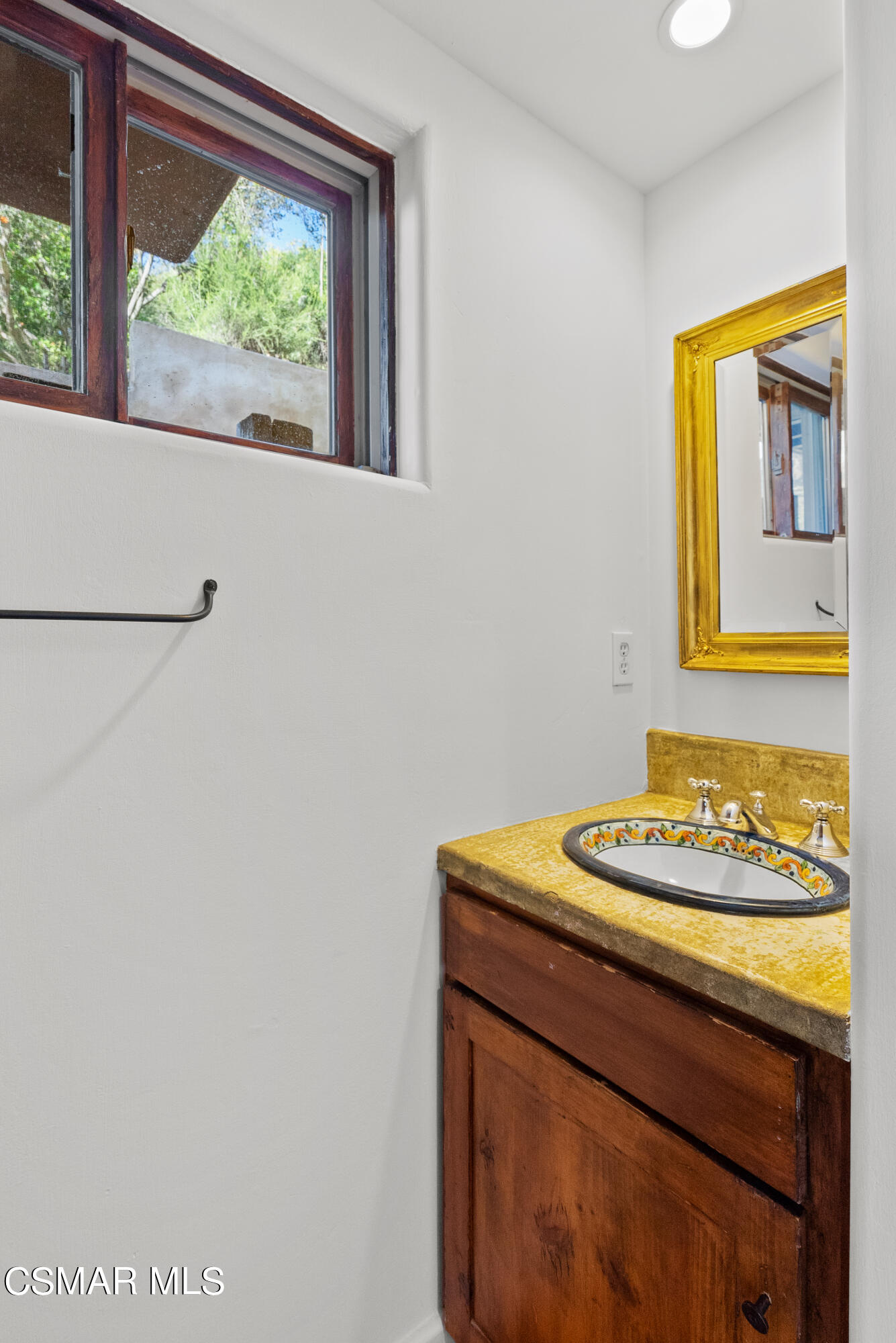 2045 Lookout Drive Agoura Hills, CA 91301 - Photo 27 of 34 a bathroom with a sink and a window