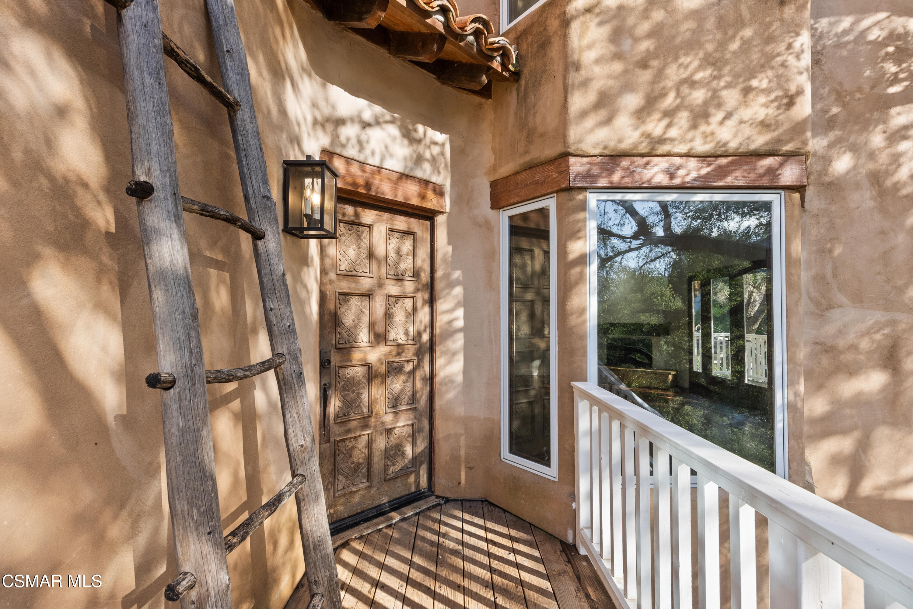 2045 Lookout Drive Agoura Hills, CA 91301 - Photo 5 of 34 a view of a brick house with a glass door