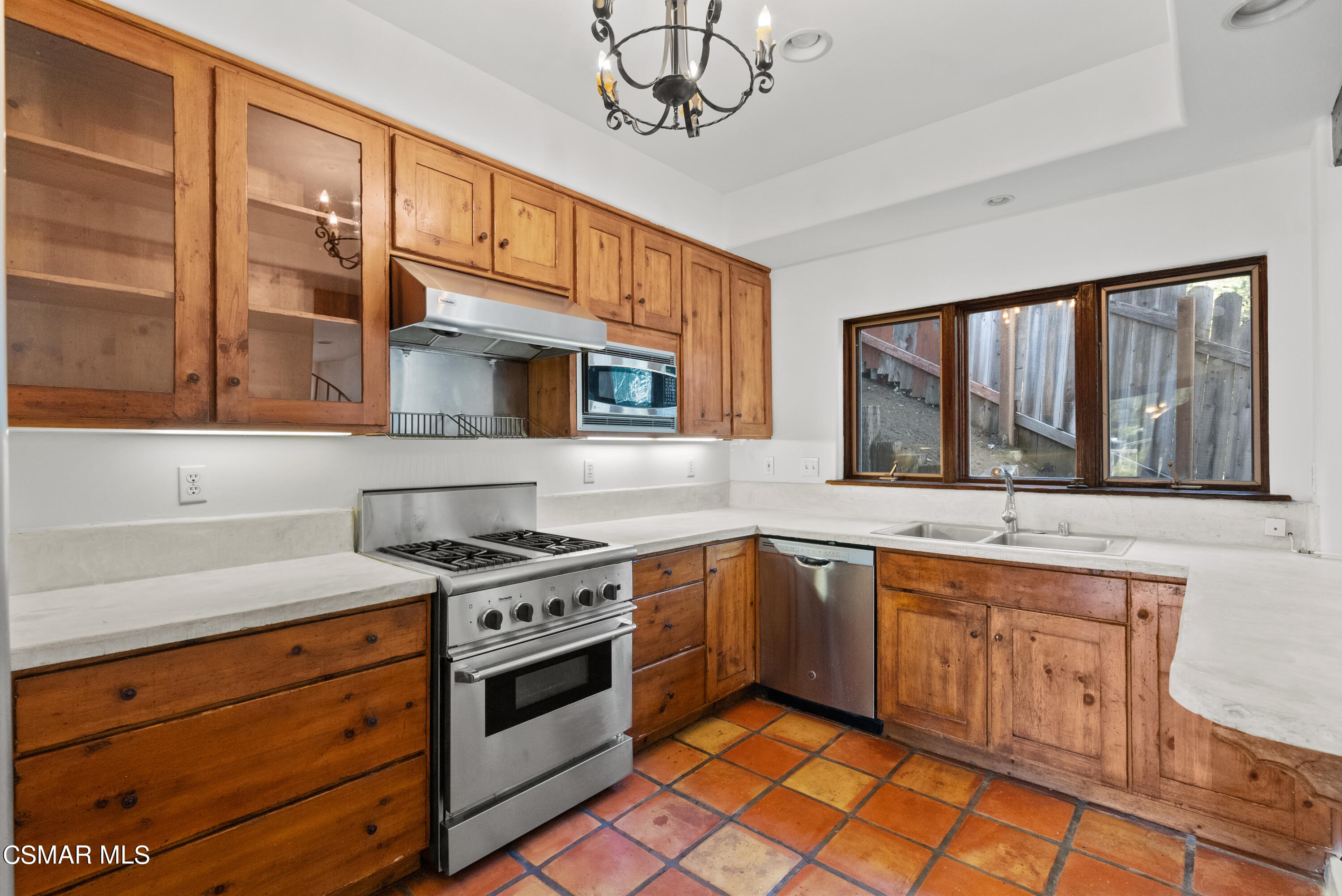 2045 Lookout Drive Agoura Hills, CA 91301 - Photo 6 of 34 a kitchen with stainless steel appliances granite countertop a stove a sink and a microwave