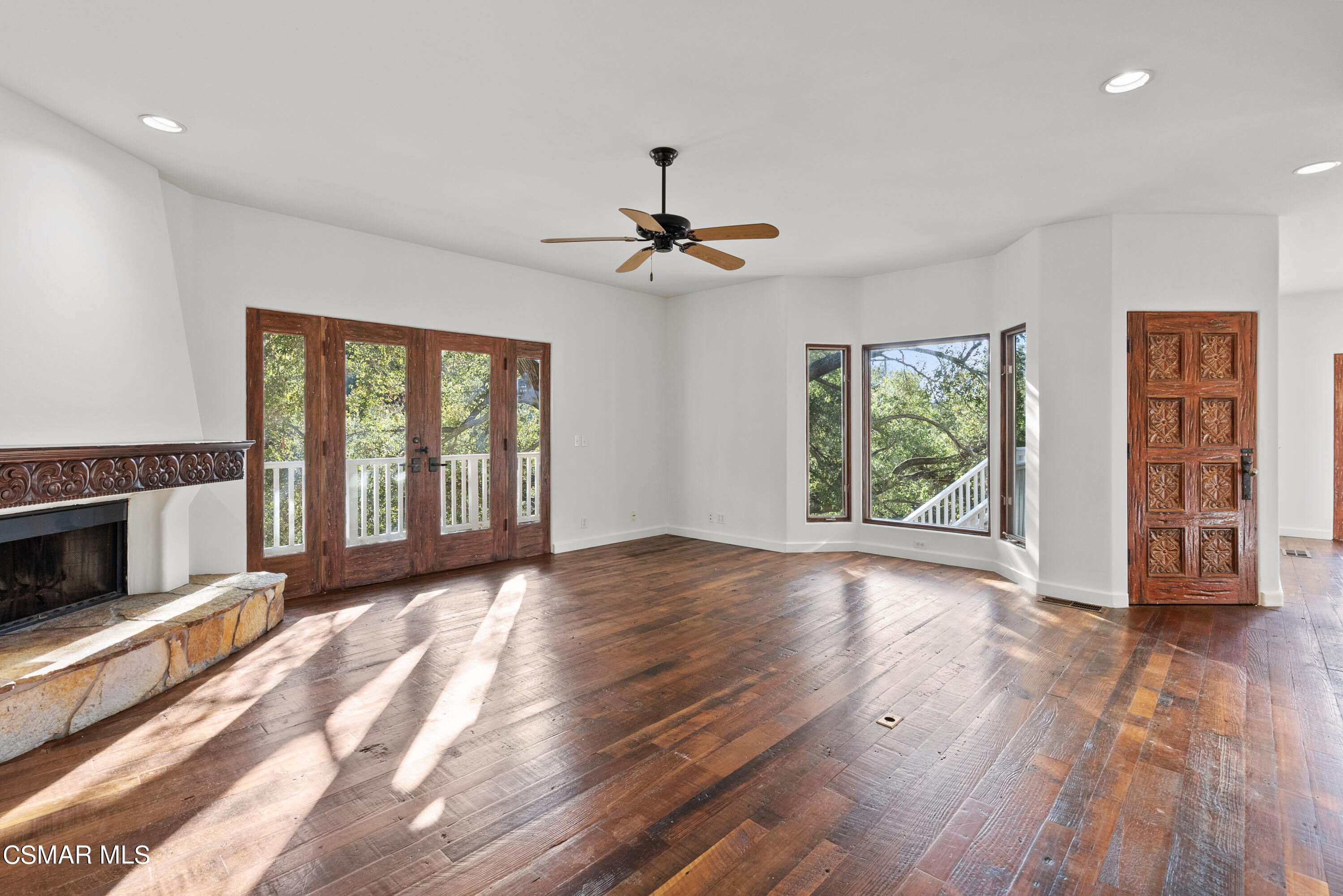 2045 Lookout Drive Agoura Hills, CA 91301 - Photo 8 of 34 a view of an empty room with window wooden floor and a kitchen