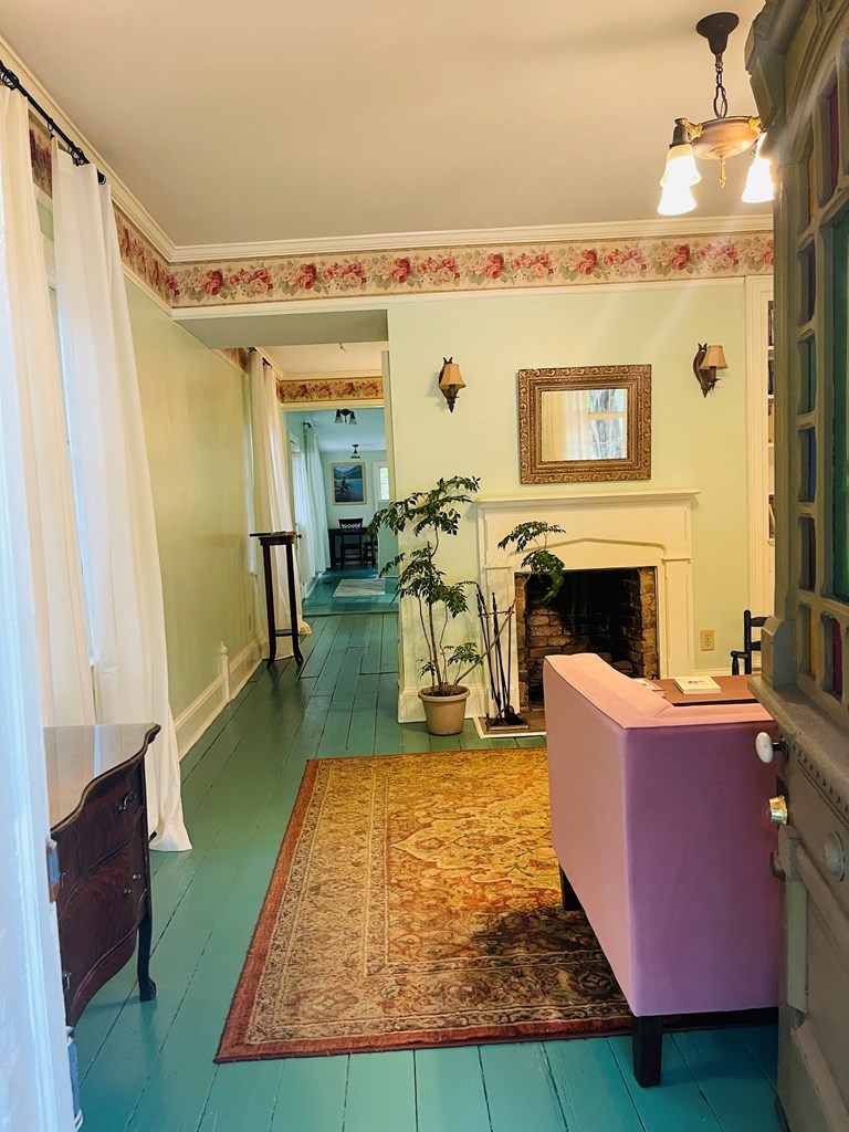 212 West 7th Street Columbus, GA 31901 - Photo 15 of 20 a living room with furniture and a fireplace