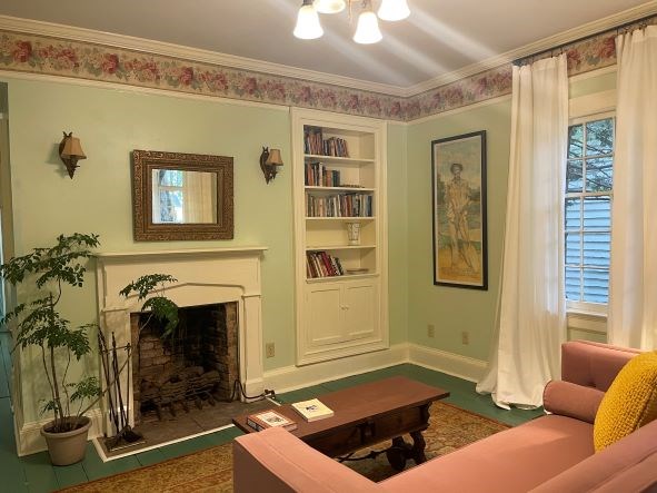 212 West 7th Street Columbus, GA 31901 - Photo 17 of 20 a living room with furniture and a fireplace