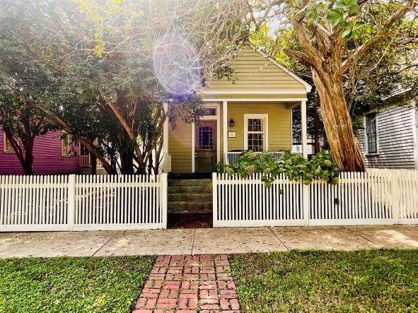 212 West 7th Street Columbus, GA 31901 - Photo 20 of 20 a front view of a house with a garden