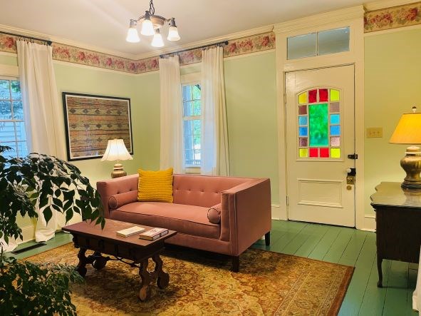 212 West 7th Street Columbus, GA 31901 - Photo 3 of 20 a living room with furniture and a table