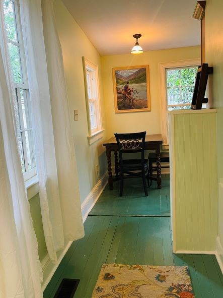 212 West 7th Street Columbus, GA 31901 - Photo 10 of 20 a bedroom with a bed and a table