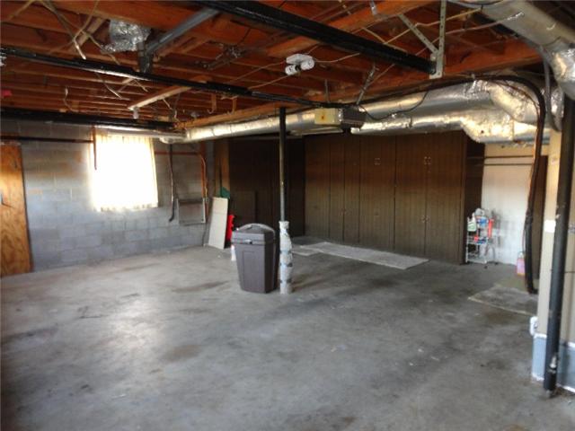 2109 Post Road Clarksville, TN 37043 - Photo 18 of 20 Two car garage located in the basement with built in cabinets
