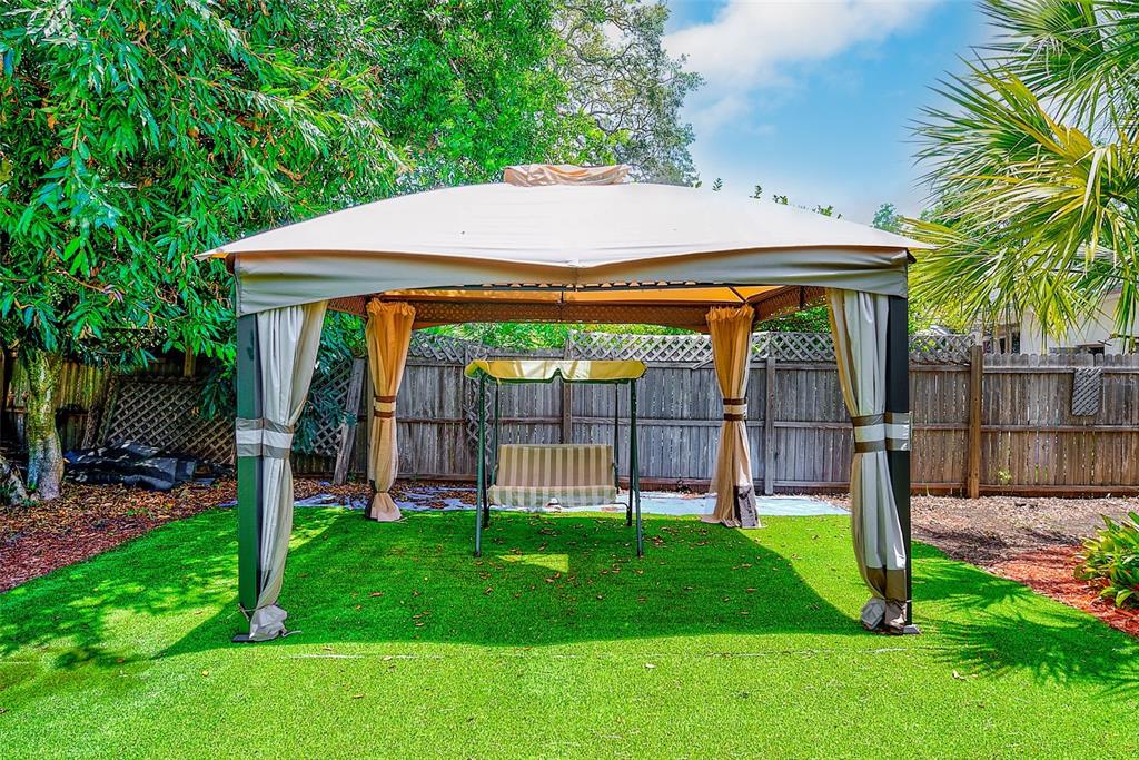 14079 Victoria Road Largo, FL 33774 - Photo 36 of 46 a view of a backyard with a garden and plants