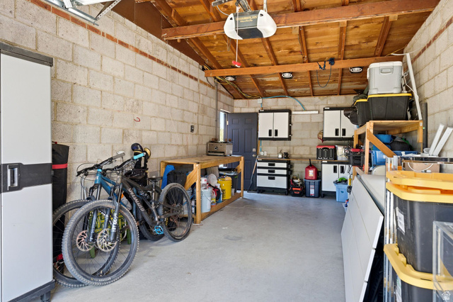 935 900 North Bountiful, UT 84010 - Photo 31 of 46 Garage with concrete block wall and a garage door opener