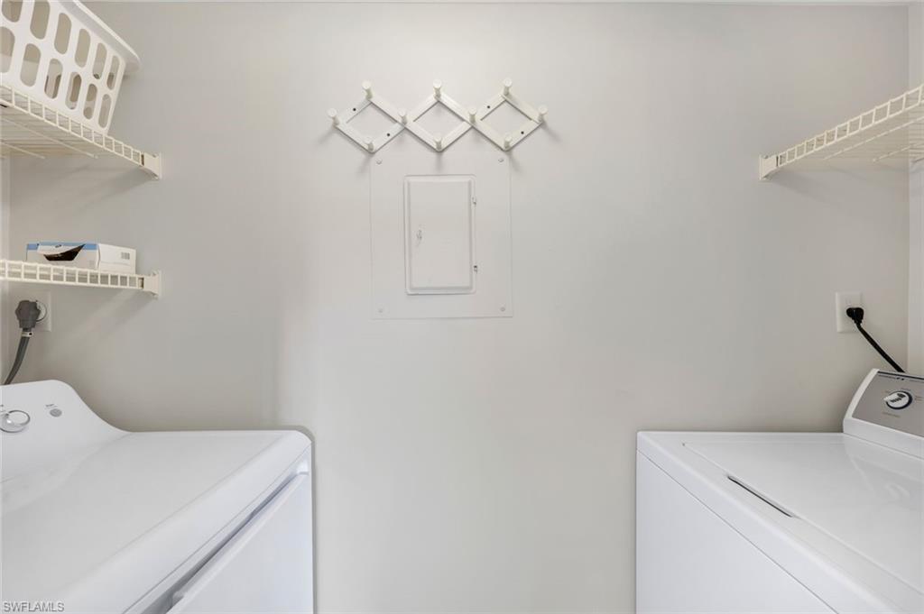 37 High Point Circle East, Unit 109 Naples, FL 34103 - Photo 16 of 37 a utility room with dryer and washer