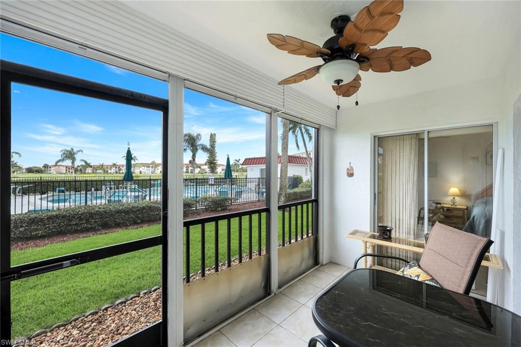 37 High Point Circle East, Unit 109 Naples, FL 34103 - Photo 17 of 37 a view of a porch with furniture and garden