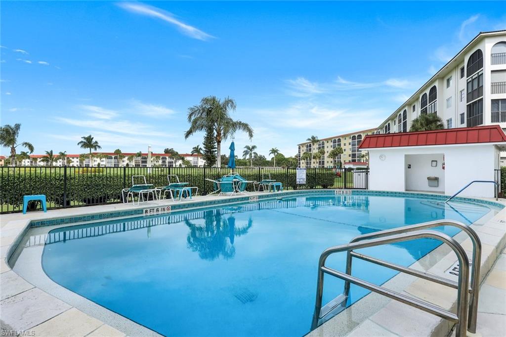 37 High Point Circle East, Unit 109 Naples, FL 34103 - Photo 21 of 37 a view of a swimming pool with a terrace