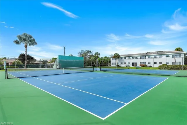 a view of an outdoor space and tennis court