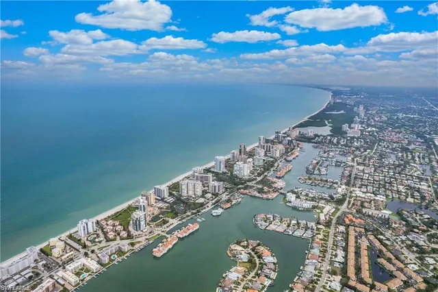a sign broad in front of flowers