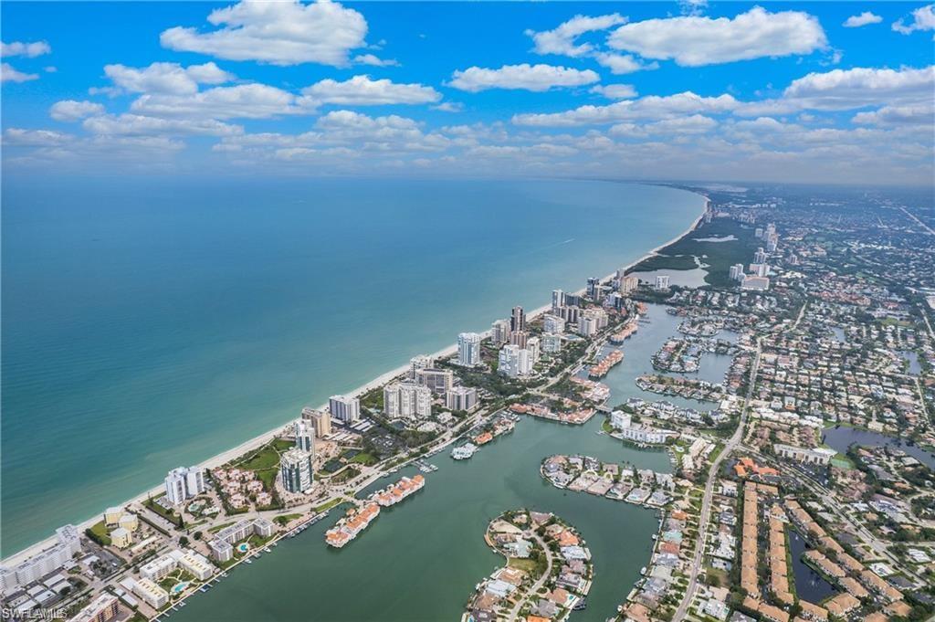 37 High Point Circle East, Unit 109 Naples, FL 34103 - Photo 36 of 37 a view of water heater with sky view