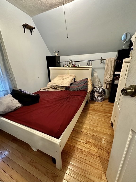 4 Glendale Place Everett, MA 02149 - Photo 12 of 14 a bed room with a bed