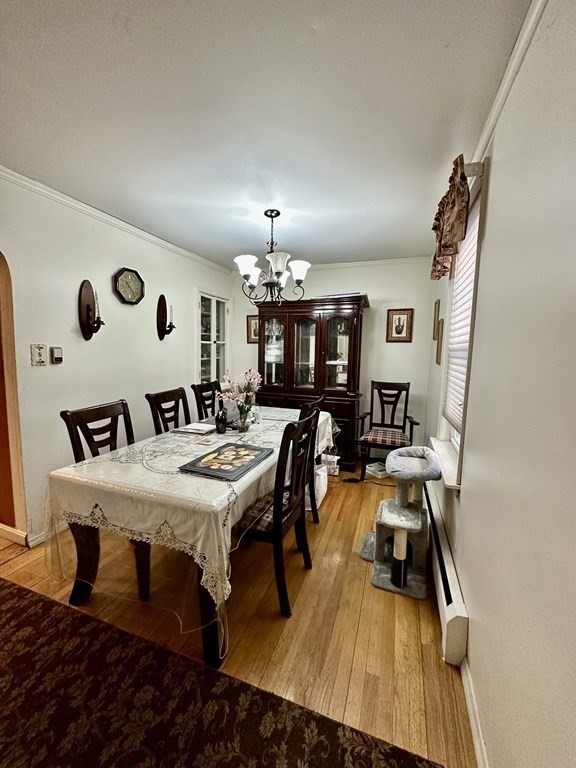 4 Glendale Place Everett, MA 02149 - Photo 6 of 14 a view of a dining room with furniture and chandelier