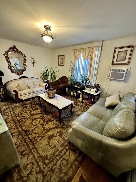 4 Glendale Place Everett, MA 02149 - Photo 7 of 14 a living room with furniture and a large mirror