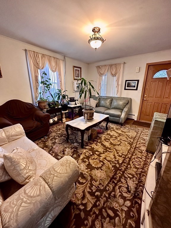 4 Glendale Place Everett, MA 02149 - Photo 8 of 14 a living room with furniture and a large window