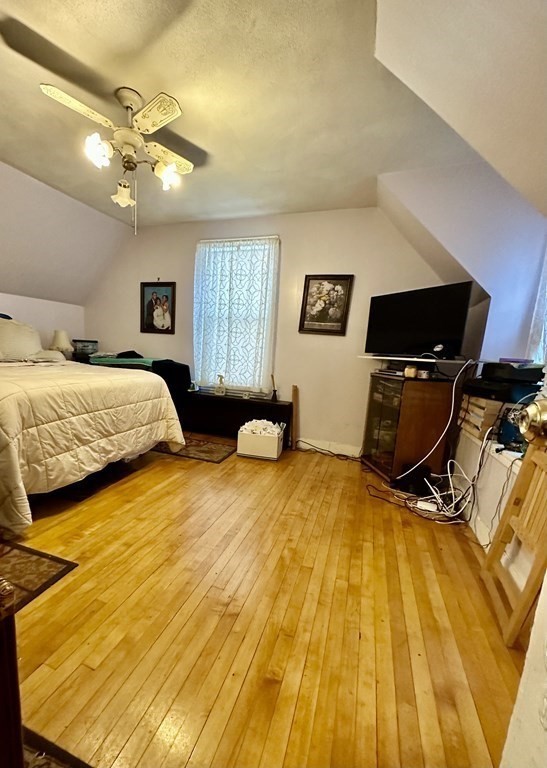 4 Glendale Place Everett, MA 02149 - Photo 10 of 14 a bedroom with a bed and window