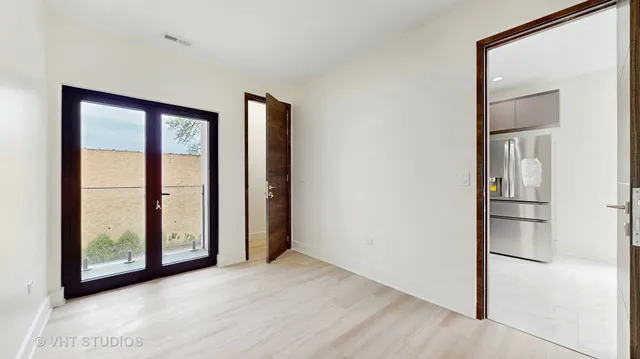 a view of workspace with window and ceiling fan