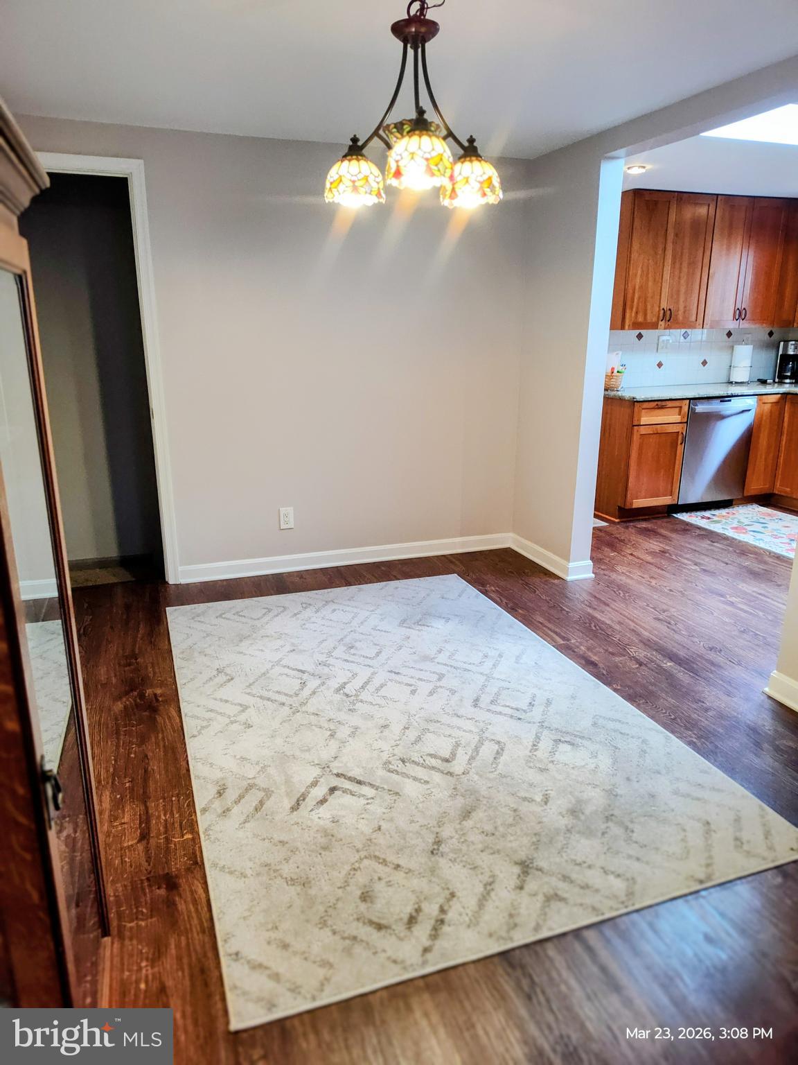 4728 Bucks School House Road Baltimore, MD 21237 - Photo 11 of 64 wooden floor in an empty room with a window