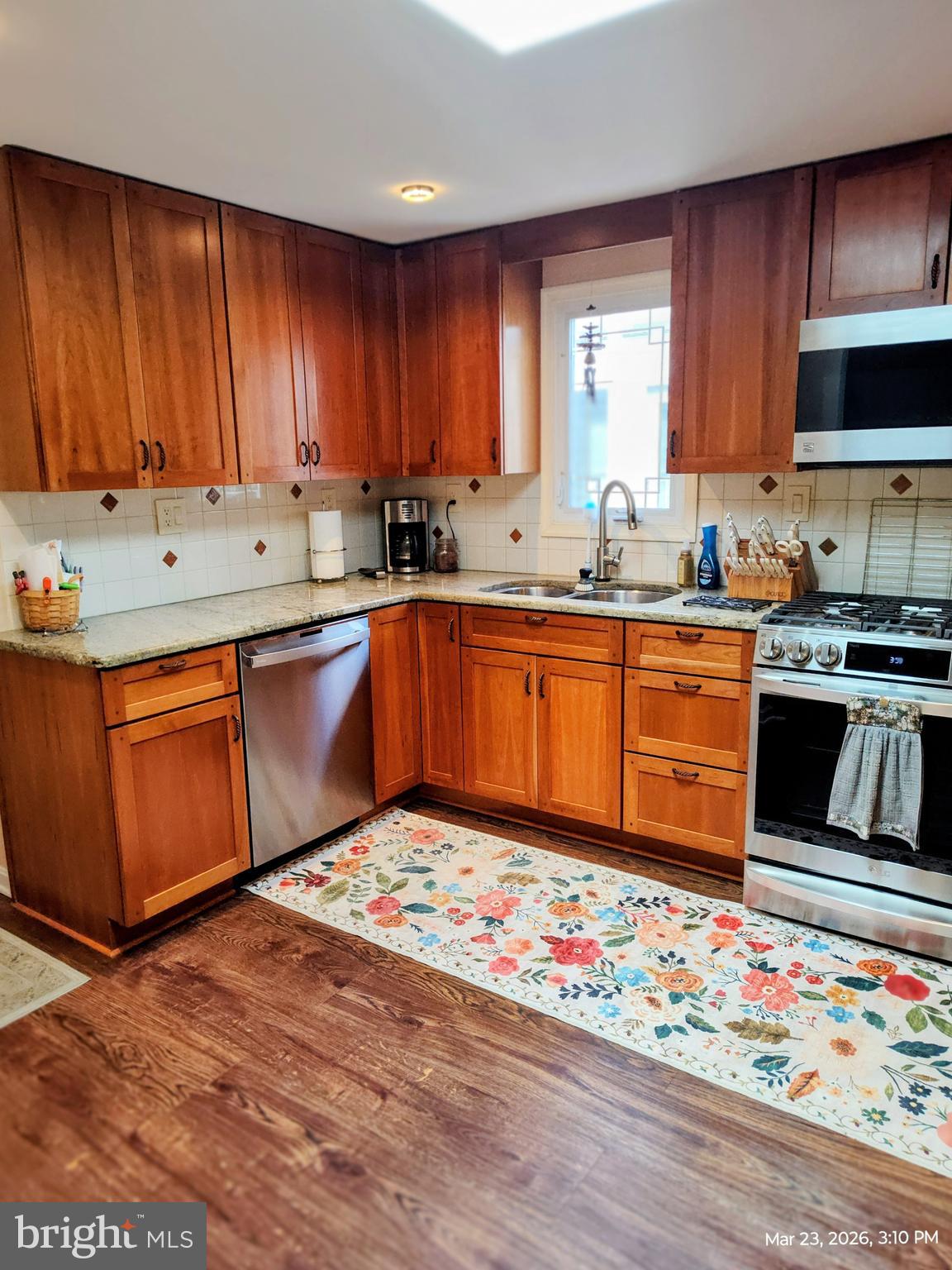 4728 Bucks School House Road Baltimore, MD 21237 - Photo 14 of 64 a kitchen with stainless steel appliances granite countertop wooden cabinets sink and stove