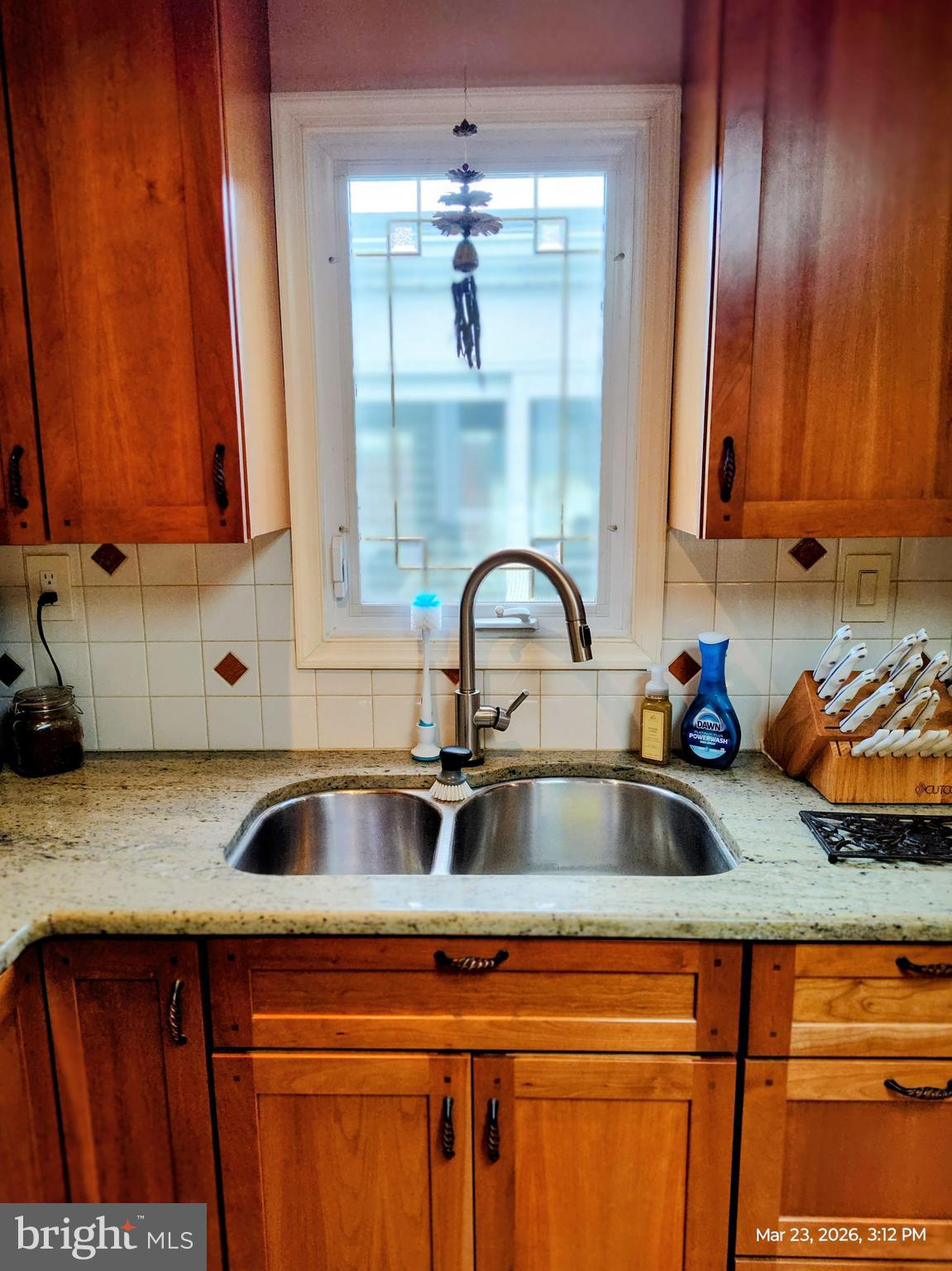 4728 Bucks School House Road Baltimore, MD 21237 - Photo 16 of 64 a kitchen with a sink and cabinets