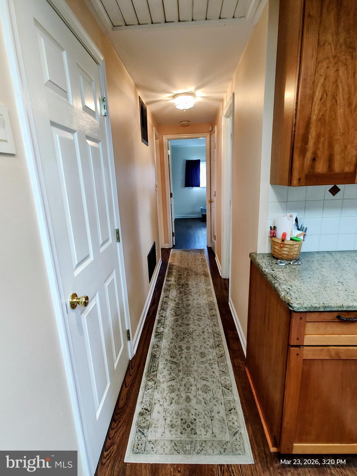 4728 Bucks School House Road Baltimore, MD 21237 - Photo 27 of 64 a view of a hallway with wooden floor and staircase