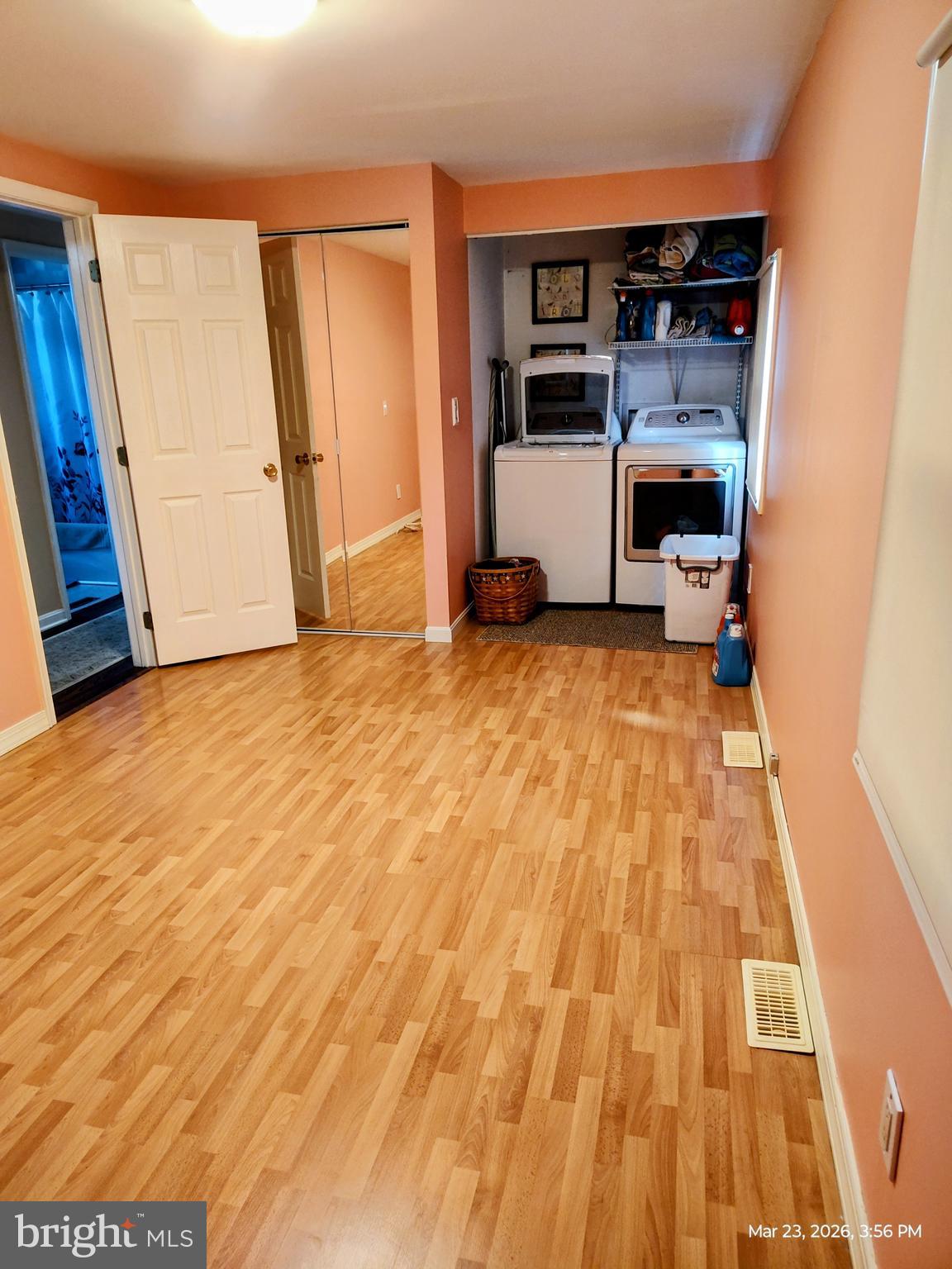 4728 Bucks School House Road Baltimore, MD 21237 - Photo 29 of 64 a view of empty room with wooden floor and cabinet