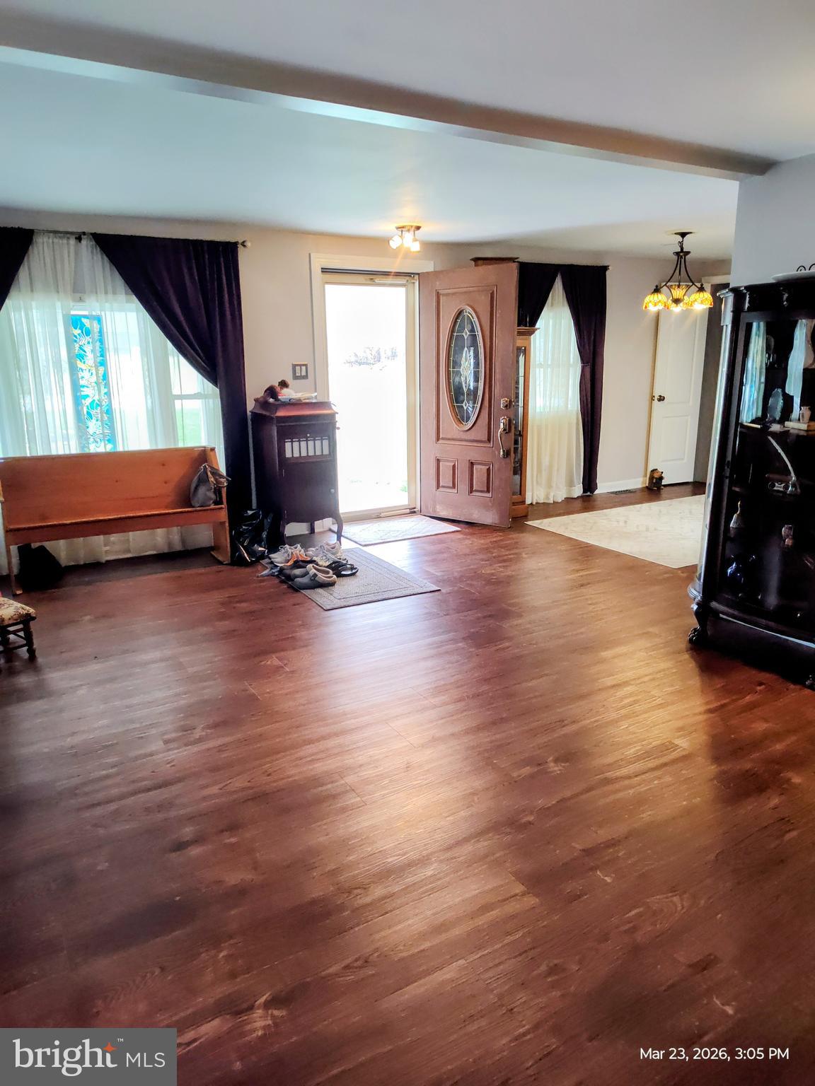 4728 Bucks School House Road Baltimore, MD 21237 - Photo 7 of 64 a view of empty room with wooden floor and fan