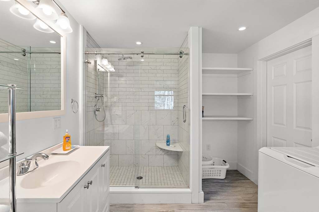 13 Young Street Edgartown, MA 02539 - Photo 19 of 29 a bathroom with a shower a sink a toilet and shower