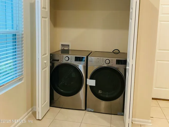 a utility room with dryer and washer