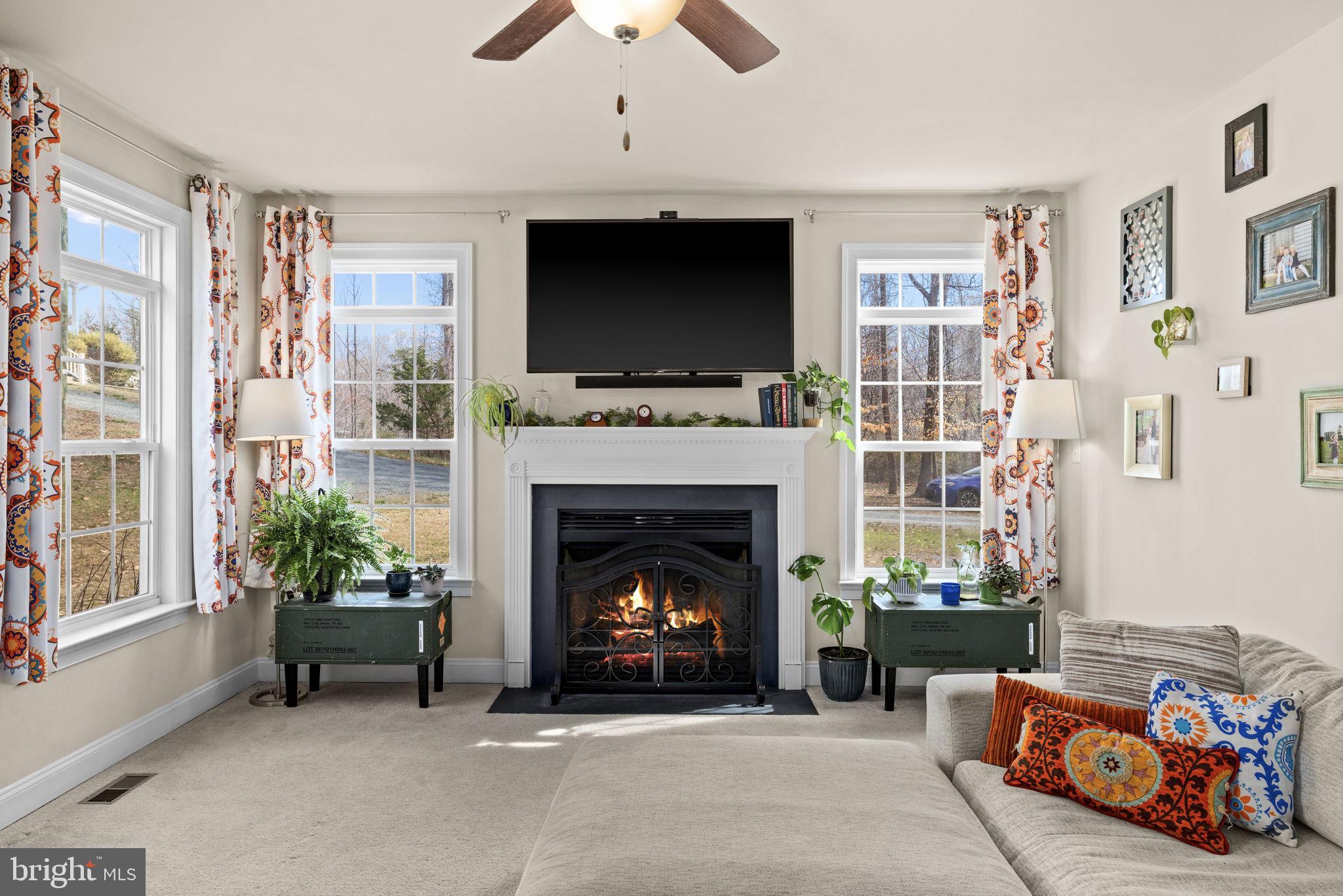 476 Decatur Road Stafford, VA 22554 - Photo 25 of 62 So bright! Gas log fireplace and carpeted floors