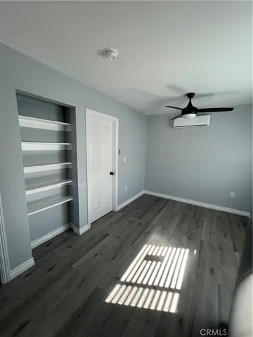 a view of an empty room and a window