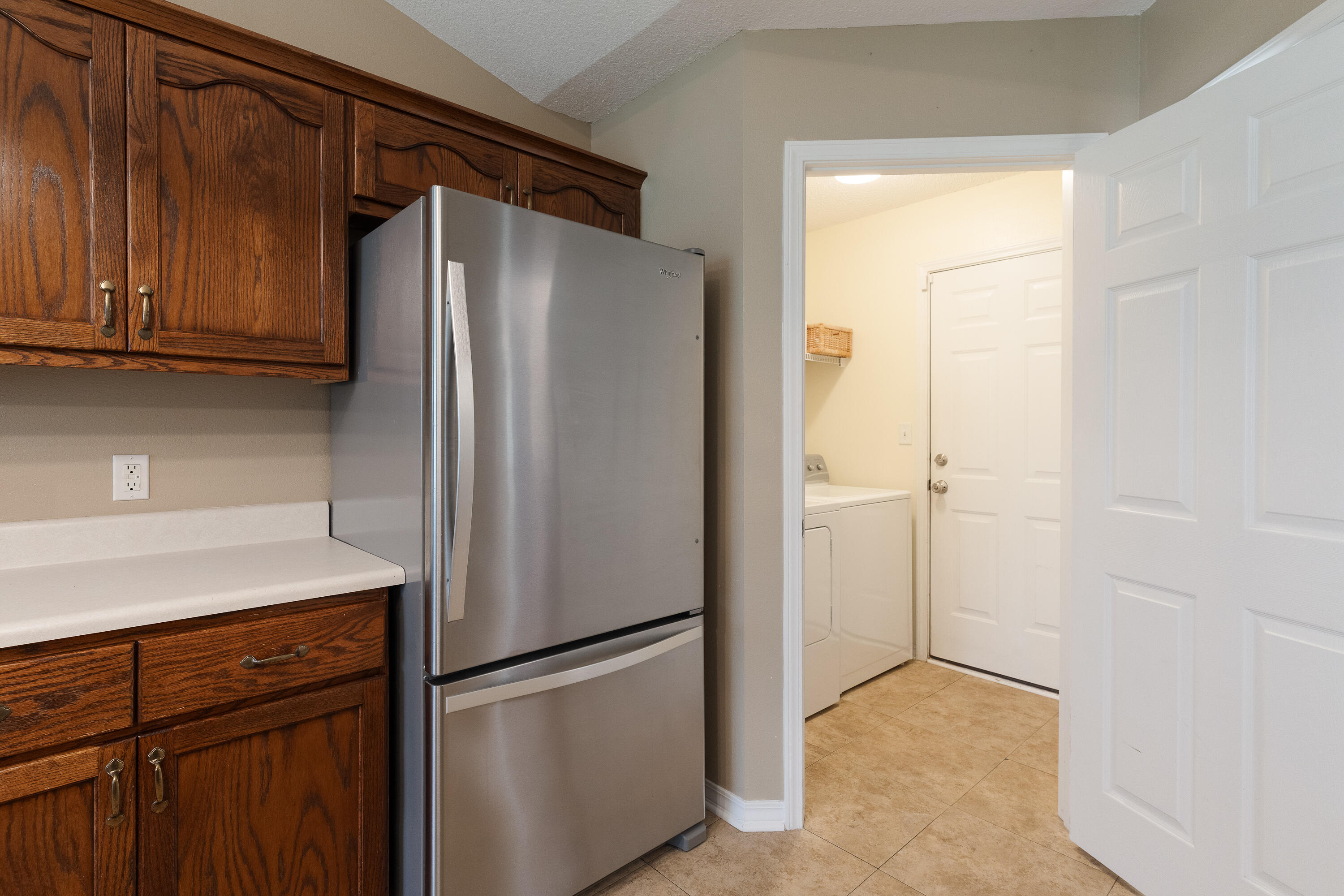 6100 Buckward Road Baker, FL 32531 - Photo 35 of 55 a metallic refrigerator freezer sitting in a kitchen