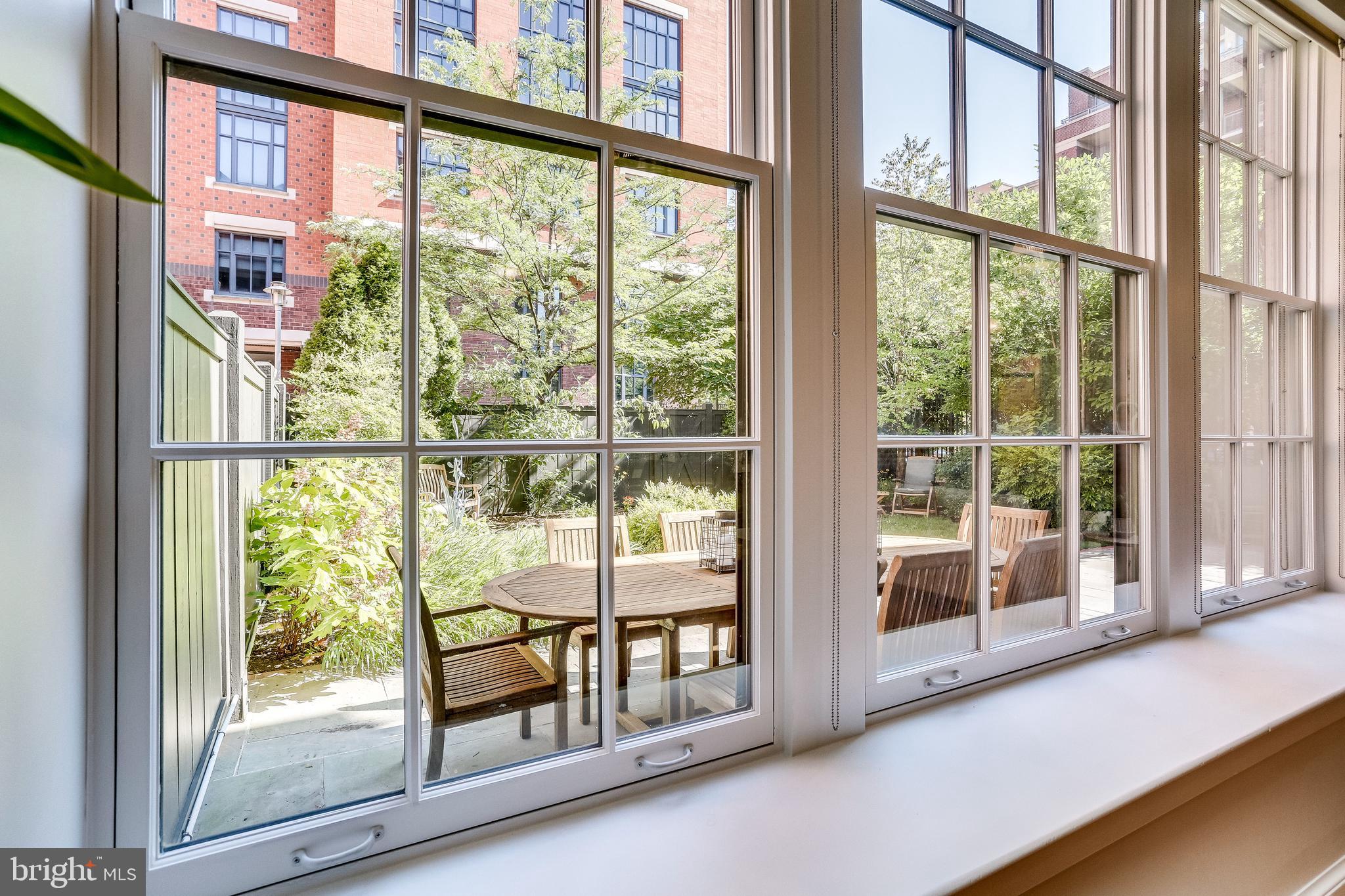 215 I Street Northeast, Unit 104 Washington, DC 20002 - Photo 16 of 63 View of garden from oversized windows